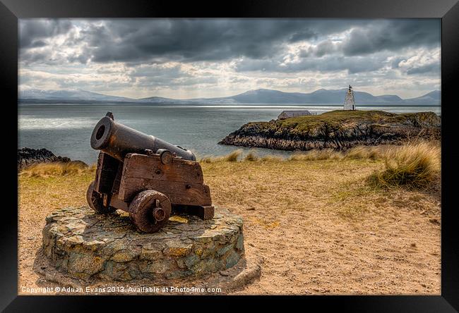 Cannon at Llanddwyn Island Framed Print by Adrian Evans
