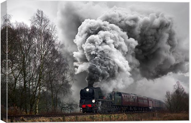 A historic steam locomotive produces volcanic exha Canvas Print by Ian Duffield