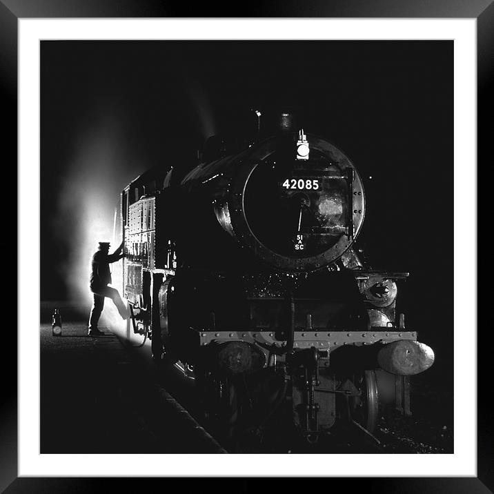 Steam loco fireman climbing aboard Framed Mounted Print by Ian Duffield