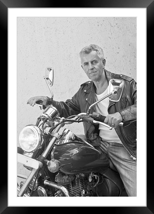 Handsome tight lipped senior motorbiker on Indian  Framed Mounted Print by Arfabita  