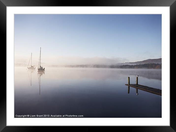 Morning mist and boats on Lake Windermere. Framed Mounted Print by Liam Grant