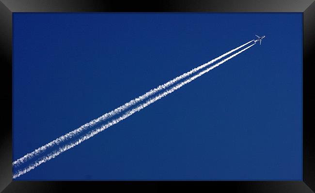 Airplane trail in blue sky Framed Print by patrick dinneen