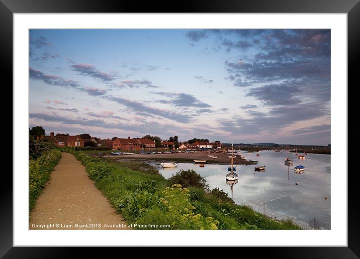 Boats and coastal path, Burnham Overy Staithe, Nor Framed Mounted Print by Liam Grant