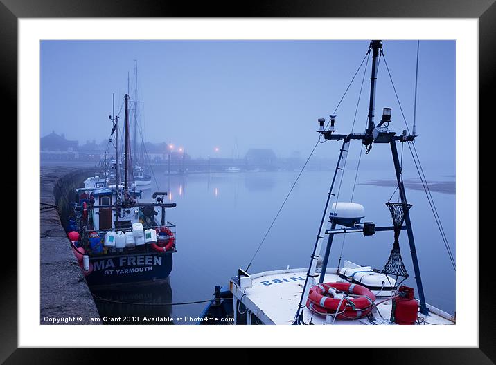 Fishing boats and fog over harbour at dawn. Wells- Framed Mounted Print by Liam Grant