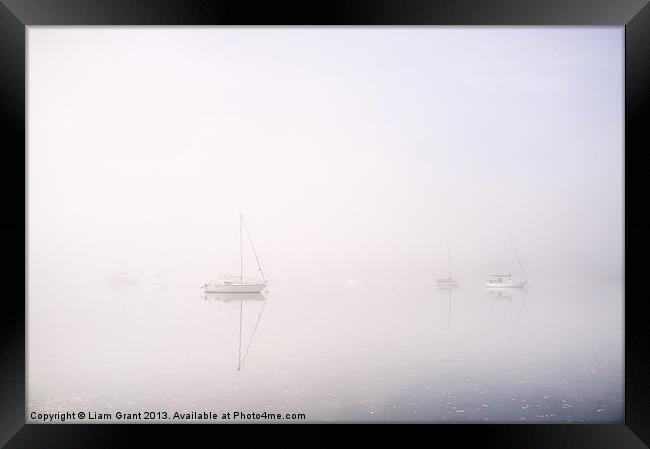 Boats in fog on Lake Windermere. Waterhead, Lake D Framed Print by Liam Grant