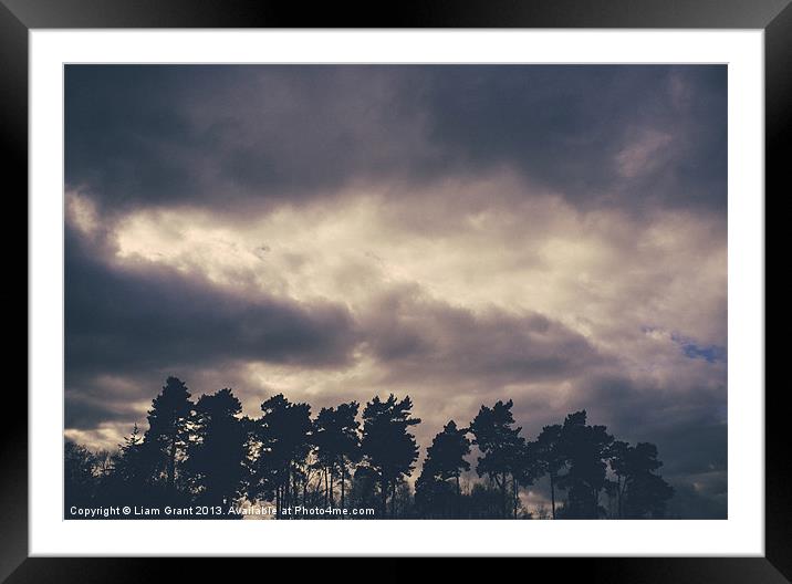 Rainclouds at sunset. Lynford, Norfolk, UK. Framed Mounted Print by Liam Grant