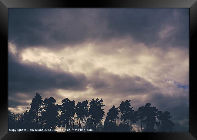 Rainclouds at sunset. Lynford, Norfolk, UK. Framed Print by Liam Grant