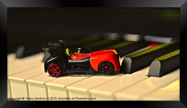 Car Toy on the Piano Framed Print by Telmo Zaldivar Jr