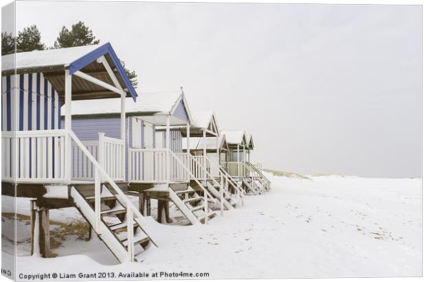 Beach huts covered in snow. Wells-next-the-sea, No Canvas Print by Liam Grant