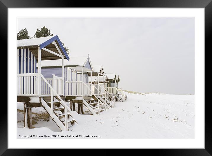 Beach huts covered in snow. Wells-next-the-sea, No Framed Mounted Print by Liam Grant