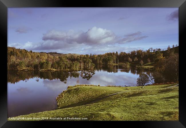 Tarn Hows and view towards Tom Heights. Lake Distr Framed Print by Liam Grant
