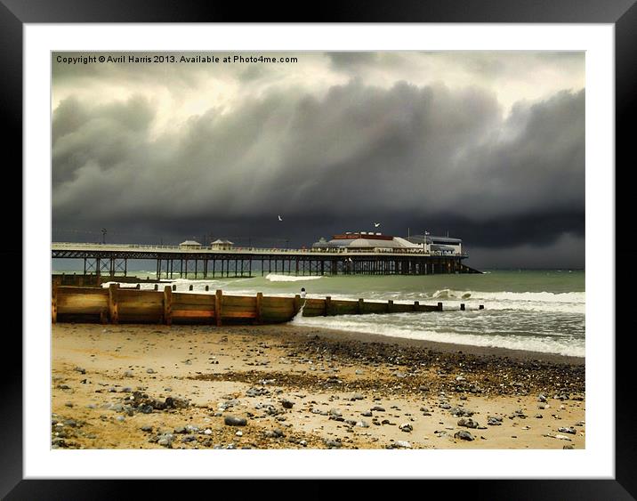 Cromer Pier Storm Framed Mounted Print by Avril Harris
