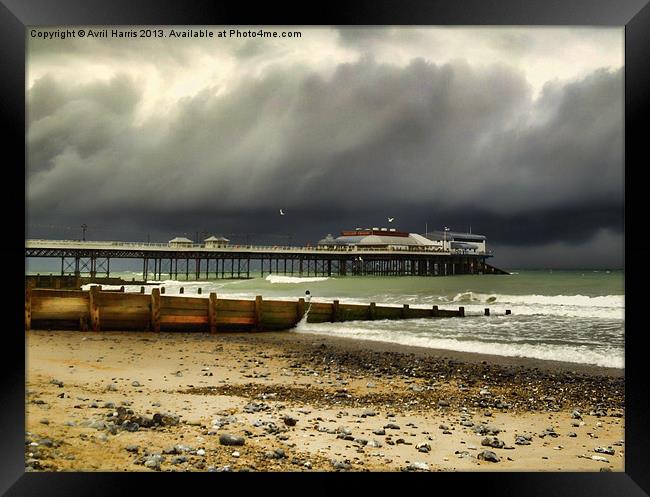 Cromer Pier Storm Framed Print by Avril Harris