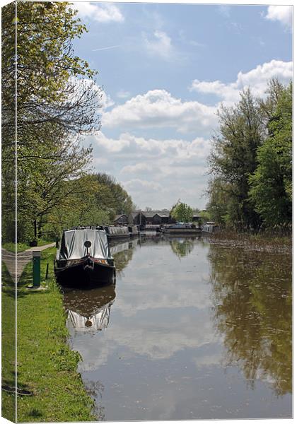 Clouds Reflected in Canal Canvas Print by Tony Murtagh