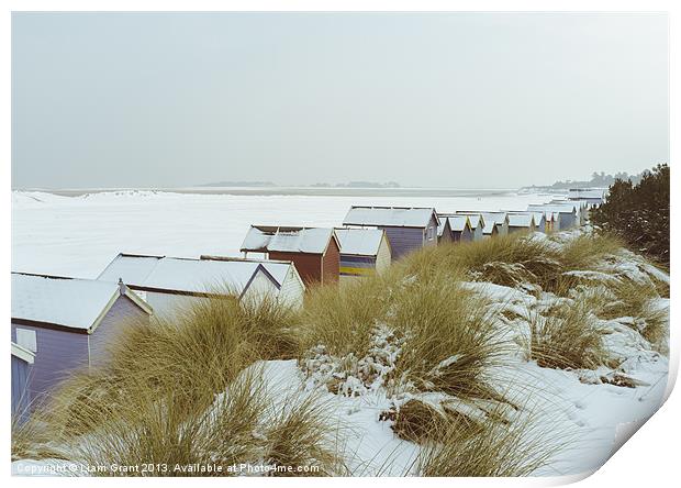 Sand dunes and beach huts covered in snow. Print by Liam Grant