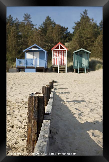 Beach huts. Wells-next-the-sea. Framed Print by Liam Grant