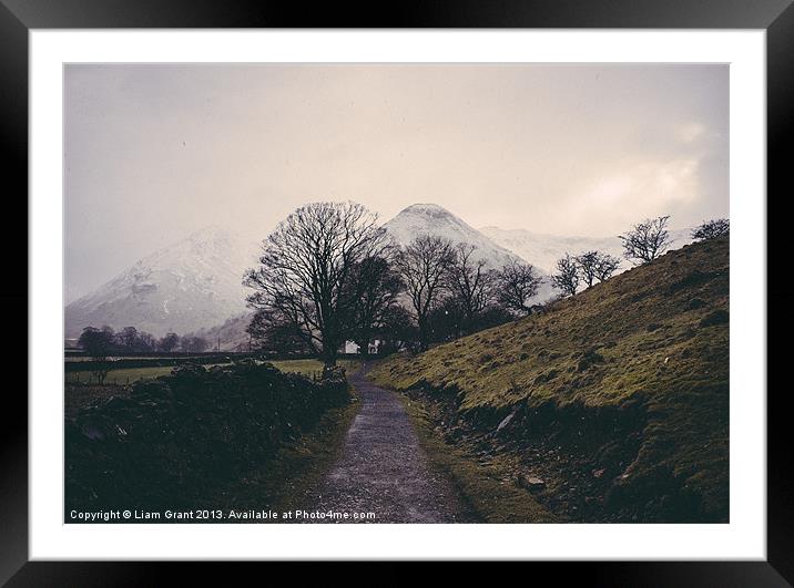 Snowing. Footpath to farmhouse. Brothers Water, La Framed Mounted Print by Liam Grant