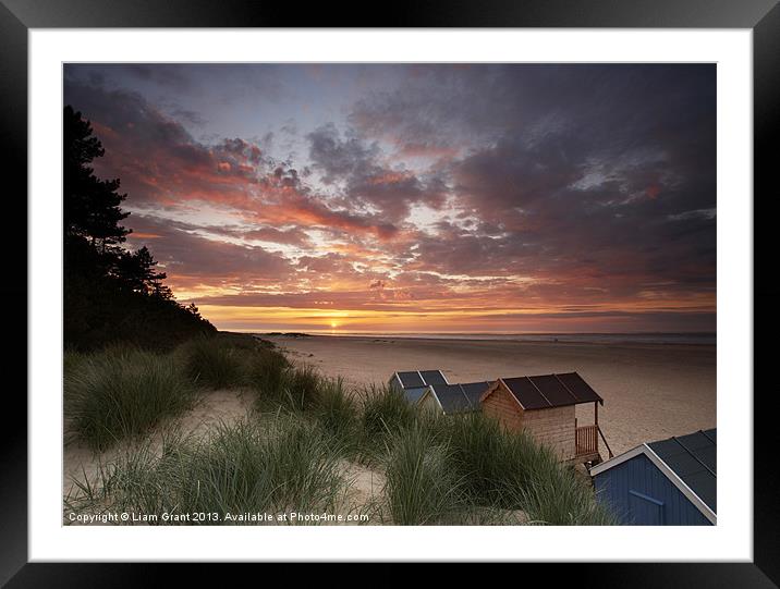 Beach huts and sunset. Framed Mounted Print by Liam Grant