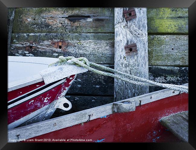 Detail of boats and seawall. Burnham Overy Staithe Framed Print by Liam Grant