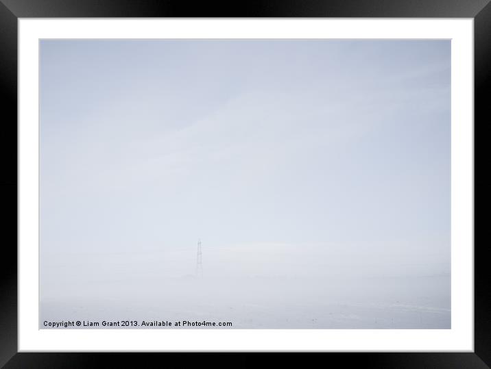 Electricity pylon in freezing fog. Framed Mounted Print by Liam Grant