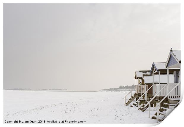 Beach huts covered in snow. Print by Liam Grant