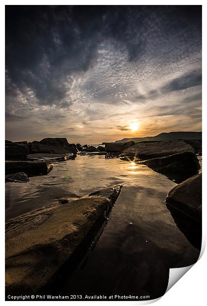 Sunset over a rock pool Print by Phil Wareham