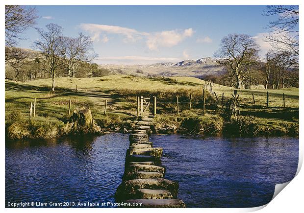 Stepping stones over the River Rothay near Amblesi Print by Liam Grant