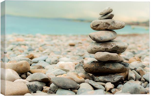 Pebble Tower on the beach Canvas Print by Andrew Lee