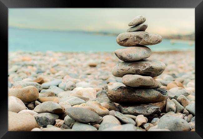 Pebble Tower on the beach Framed Print by Andrew Lee