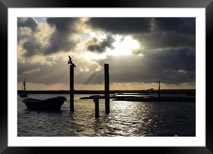 Brancaster Staithe God ray silhouette Framed Mounted Print by Gary Pearson