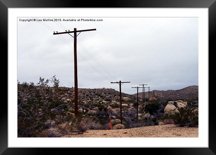 Telephone poles crossing the desert Framed Mounted Print by Lee Mullins