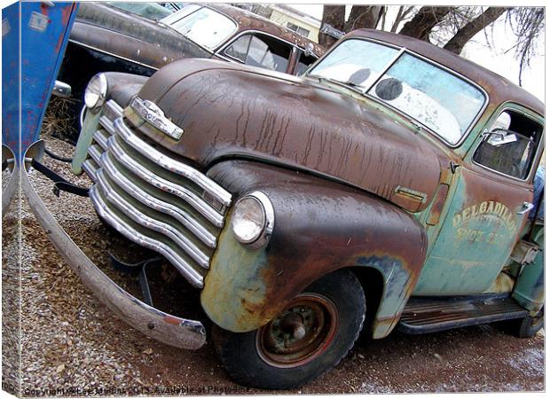 Chevy Pick-up rusting away Canvas Print by Lee Mullins