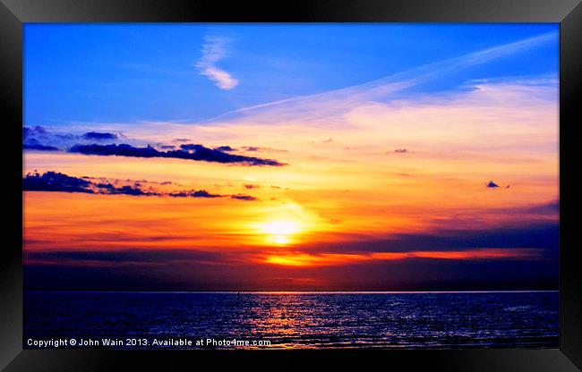 Sunset in the Bay Framed Print by John Wain