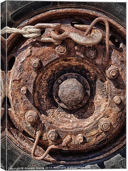 Rusty wheel Canvas Print by Graham Moore