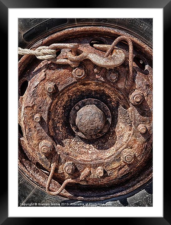 Rusty wheel Framed Mounted Print by Graham Moore