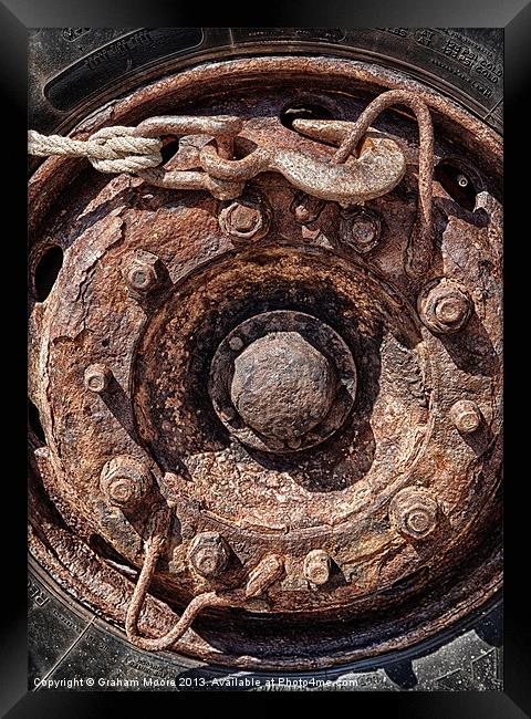 Rusty wheel Framed Print by Graham Moore