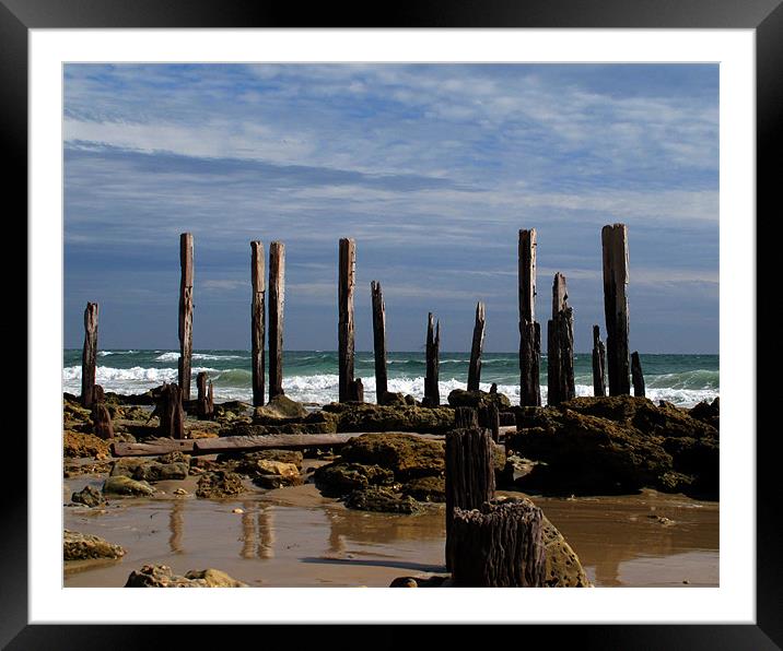 crumbling pier at low tide Framed Mounted Print by David Worthington