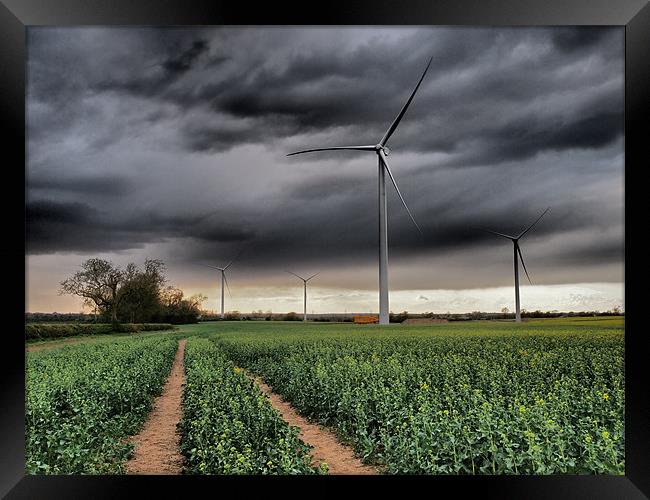 Wind Turbines with clouds Framed Print by mark humpage