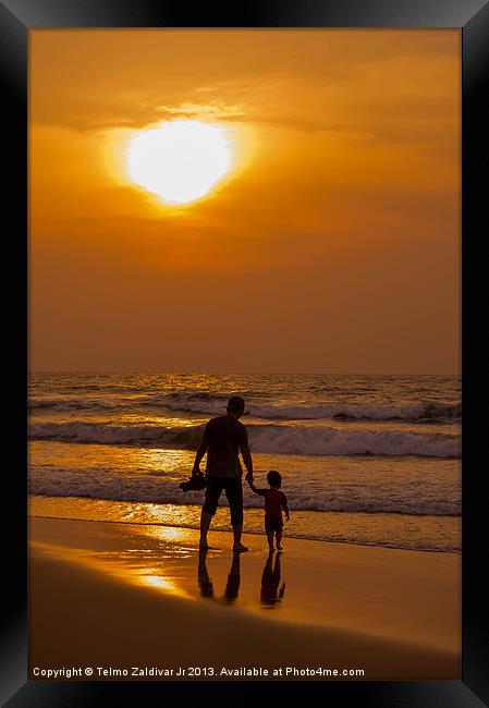 Father and son walking at the beach on Fathers Day Framed Print by Telmo Zaldivar Jr