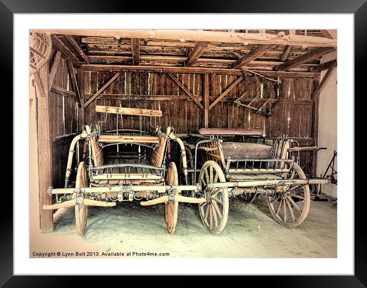 Hungarian Wooden Carts Framed Mounted Print by Lynn Bolt