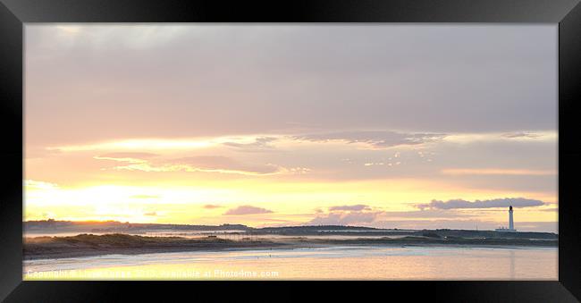 sunset over Lossiemouth beach and lighthouse Framed Print by Lloyd Fudge