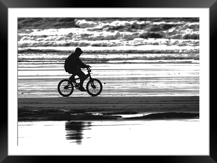 Lone Biker on Westward Ho! beach Framed Mounted Print by Mike Gorton