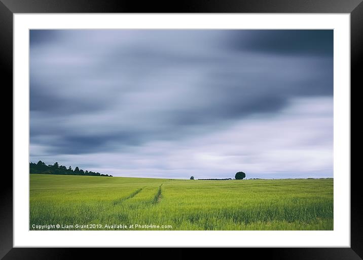 Clouds moving above field of barley. Framed Mounted Print by Liam Grant