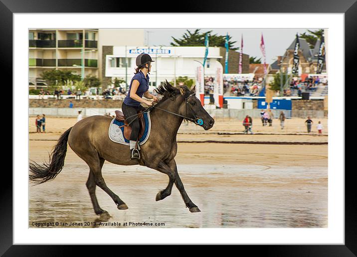 Trotting on the beach Framed Mounted Print by Ian Jones