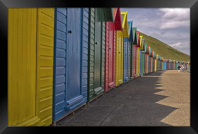 Beach huts in Whitby Framed Print by James Marsden