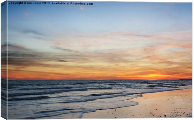 Sunset on the coast Canvas Print by Ian Jones