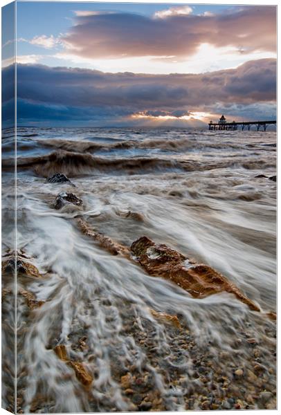 Receding through pebbles Canvas Print by mike Davies