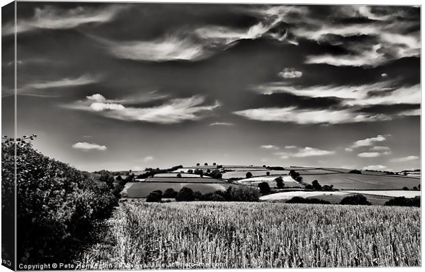 Wispy clouds over caseberry downs Canvas Print by Pete Hemington