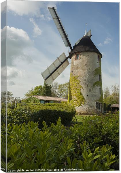 Windmill and a bicycle Canvas Print by Ian Jones