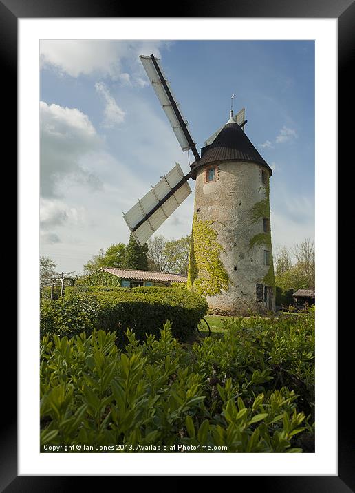 Windmill and a bicycle Framed Mounted Print by Ian Jones